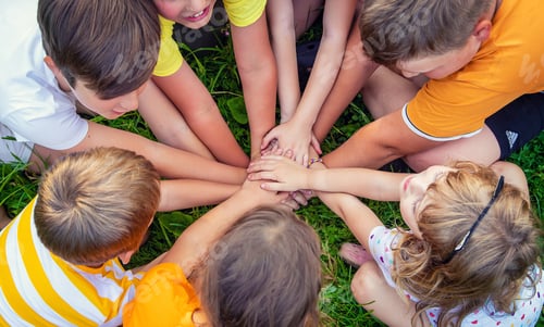 Preview: Children are playing with their hands clasped together. Selective focus.