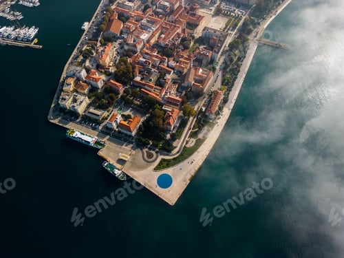 Preview: Aerial view of modern buildings near the lake on a sunny day