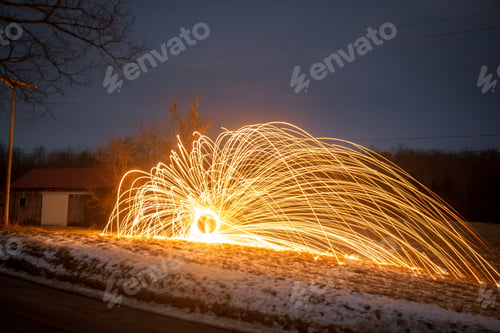 Preview: Burst of light trails in a snowy field