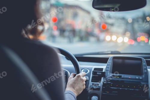 Preview: Woman driving car on city street