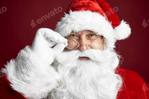 Preview: Close up of Santa Claus on the red background