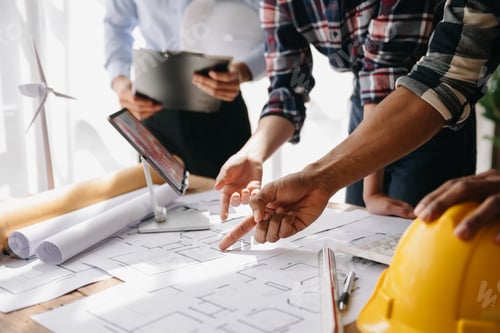 Preview: Engineer and contractor join hands after signing contract,They are having a modern building project
