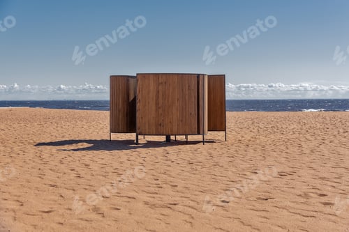 Preview: wooden natural beach cabana for changing clothes by sea on sunny day