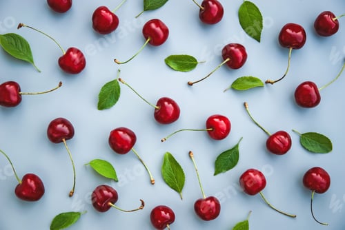 Preview: Red cherries and green leaves pattern on gray background sweet cherry fruit pattern overhead flatlay