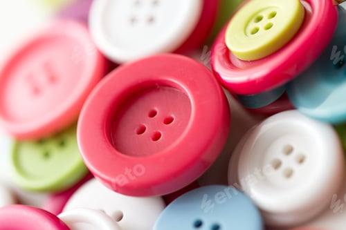 Preview: close up of sewing buttons