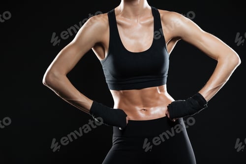 Preview: Cropped image of female fighter holding arms on hips