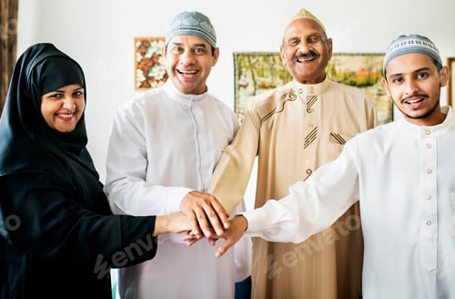 Preview: Happy family joining hands portraying teamwork and unity concept