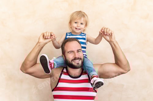 Preview: Cheerful Father Giving Toddler a Piggyback Ride