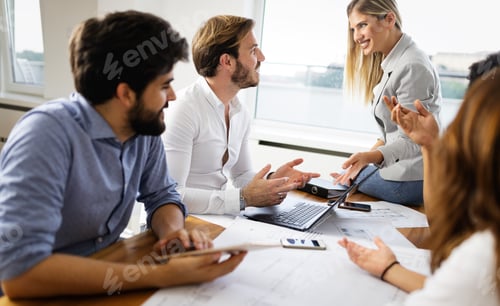 Preview: Cheerful coworkers in office during company meeting