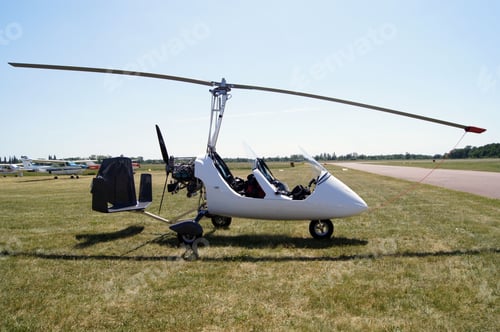 Preview: White gyroplane on green field