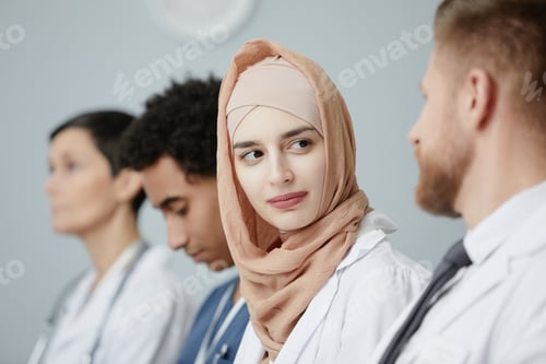Preview: Muslim woman wearing headscarf in audience at medical seminar