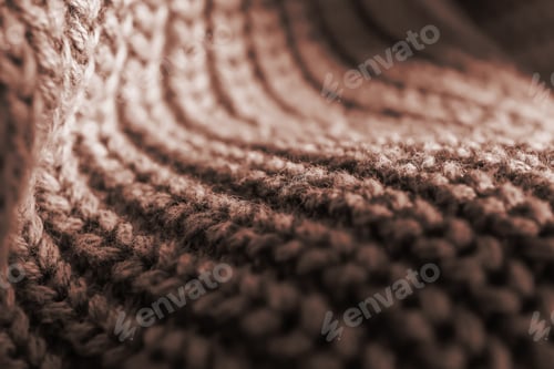 Preview: Knitted texture of a pink sweater or scarf close-up.