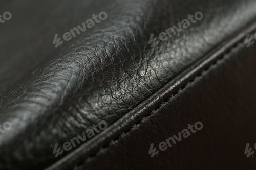 Preview: Texture of black leather as background, closeup