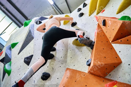 Preview: Woman training at bouldering gym. Active recreation, sports exercises