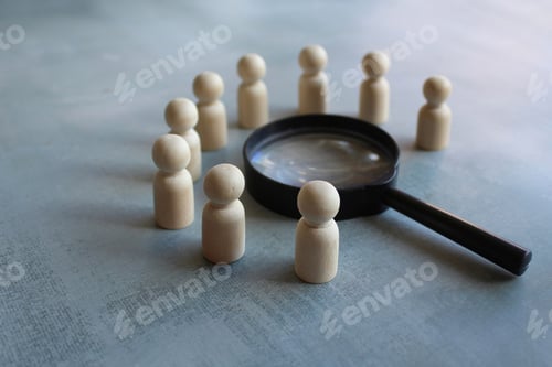 Preview: Wooden dolls and magnifying glass.
