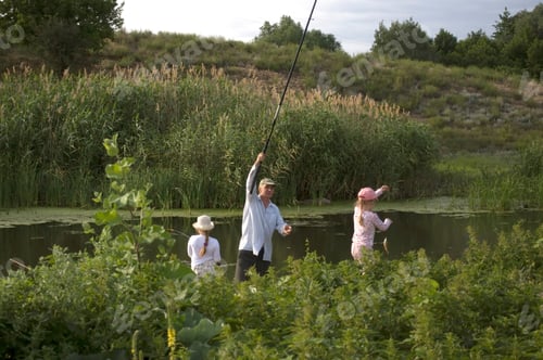 Preview: two girls with their grandfather are fishing in a pond laughing, life in the suburbs, generation z,