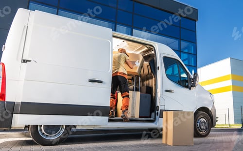 Preview: Delivery Worker Loading Boxes Into Van