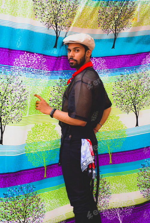 Preview: Man wearing white hat and sheer shirt indoor