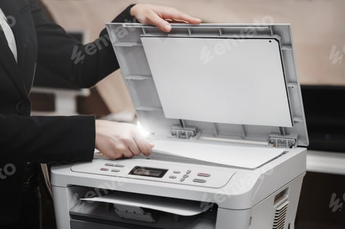 Preview: Business woman is using the printer to scanning