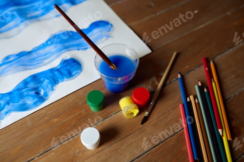 Preview: Children's drawing, paints and pencils on table
