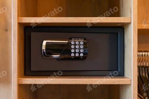 Preview: A sleek safe is mounted within a wooden shelf, featuring a digital keypad.