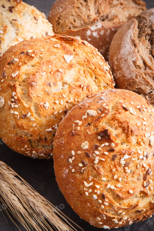 Preview: Fresh baked crunchy rolls for breakfast and ears of rye or wheat grain
