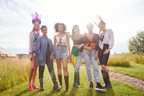 Preview: Stylish Women in a Field Wearing Festival Outfits