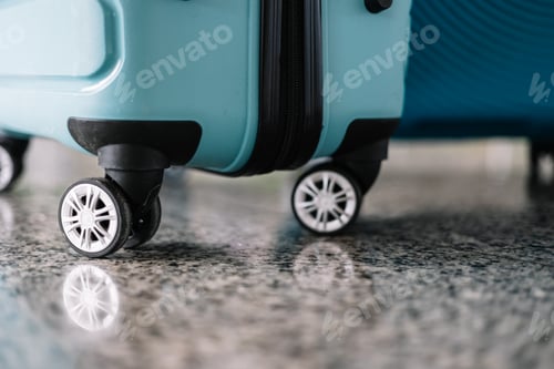 Preview: closeup detail blue luggage suitcase wheels