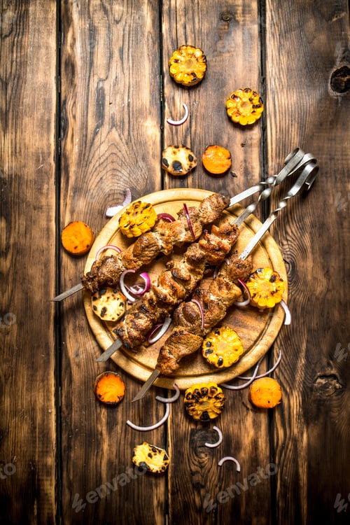 Preview: Grilled Meat Skewers with Corn on Wooden Board