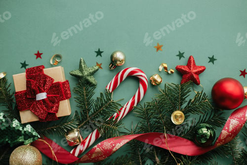 Preview: Merry Christmas! Stylish christmas border with festive decorations, confetti,gift, fir on green