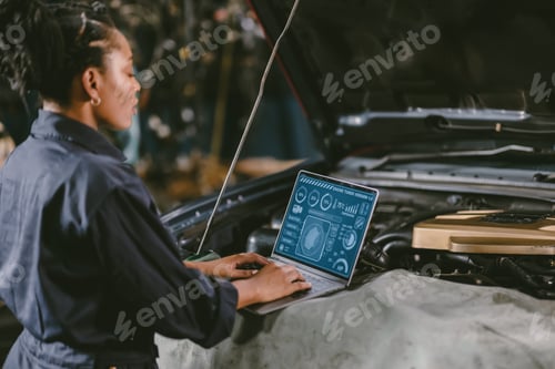 Preview: garage mechanic car engine engineer woman staff worker using laptop computer turning engine