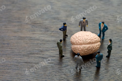 Preview: Business Team Brainstorming Ideas Around Brain Model – Innovation and Strategy Concept