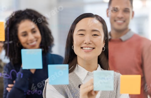 Preview: Asian woman, smile and writing schedule in planning, strategy or brainstorming on glass wall at off