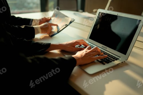 Preview: Business professionals using hand gestures to illustrate analyzing financial