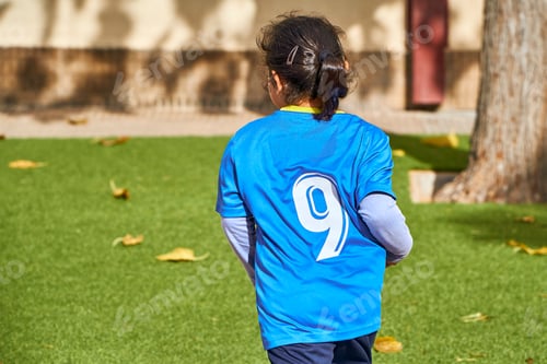 Preview: unrecognizable latin girl football player in a sport suit