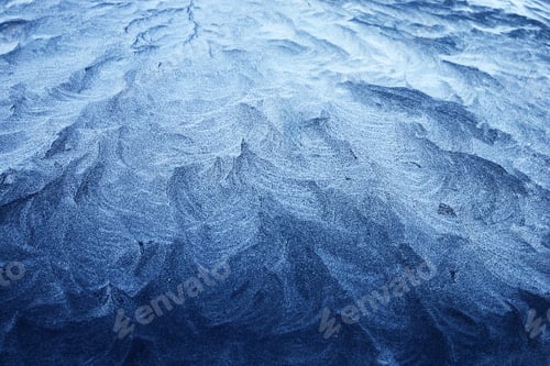 Vista previa: Frosty Patterns. Close-up of intricate frost designs on a blue surface,