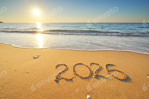 Preview: 2026 text symbol of new year on the sea sand beach shore during sunset.