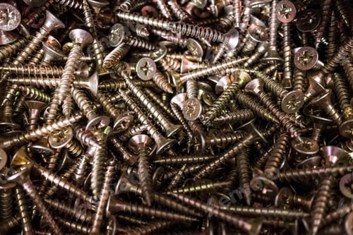 Preview: Pile of pozidriv head type screws, with a blurred background.