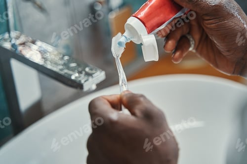 Preview: Adult African American man maintaining dental hygiene