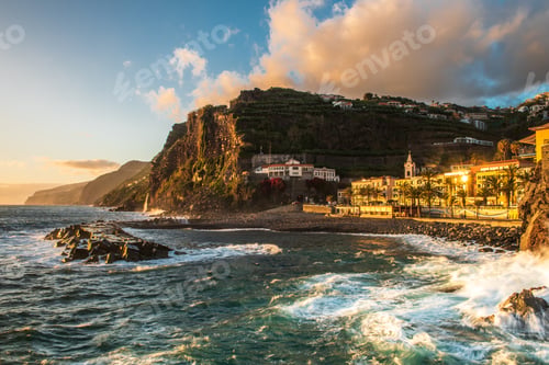Preview: Sunset at Ponta do Sol, town at atlantic ocean with beach and cliffs in Madeira, Portugal