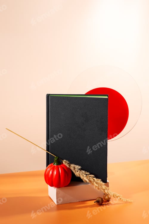 Preview: Blue book cover on the yellow background with autumn attributes
