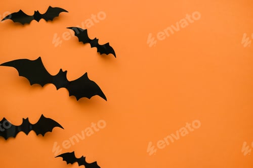Preview: Bright orange background with black bats and place for text.