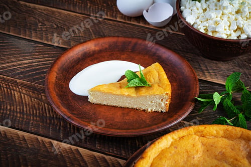 Preview: Homemade cottage cheese casserole on rustic wooden background