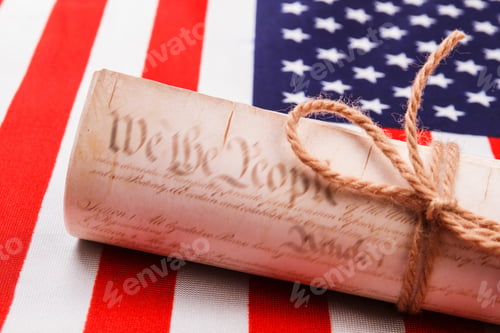 Preview: Close-up old historical document on the usa flag.