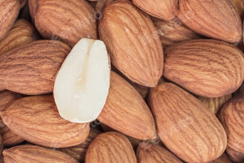 Preview: Close up raw peeled almonds seed abstract background and texture