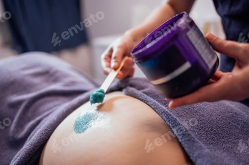 Preview: Close-up of the cosmetologist hands and a jar of salt scrub