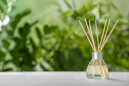 Preview: Aromatic reed freshener on table against blurred background