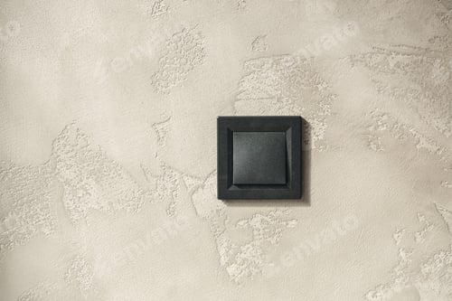 Preview: Black light switch on grey background, copy space.