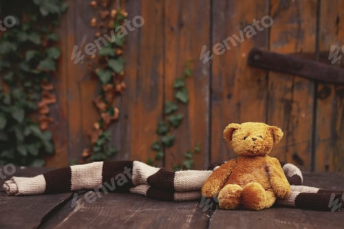 Preview: Little teddy bear toy on wooden table