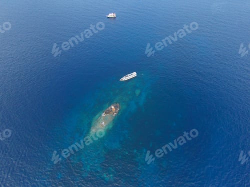 Preview: View from the airplane of a movement a big ship on the ocean background.